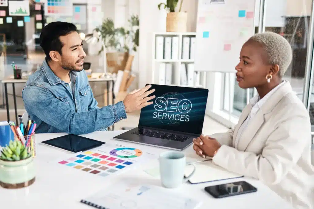 SEO specialist discussing optimization services with a client